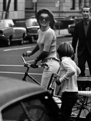 Jacqueline Kennedy Onassis and John Jr ride bikes in Central Park 1969.jpg